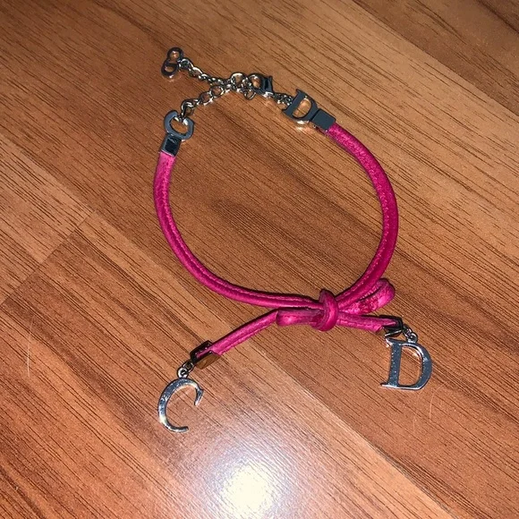 Authentic Christian Dior Leather and Metal Charm Bow Bracelet - Picture 1 of 11